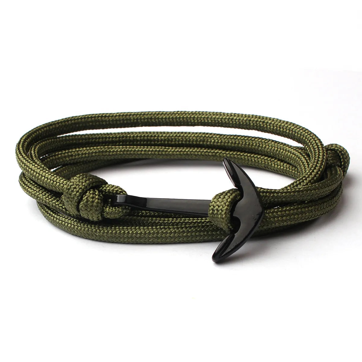 Green braided bracelet with a black clasp on a white background