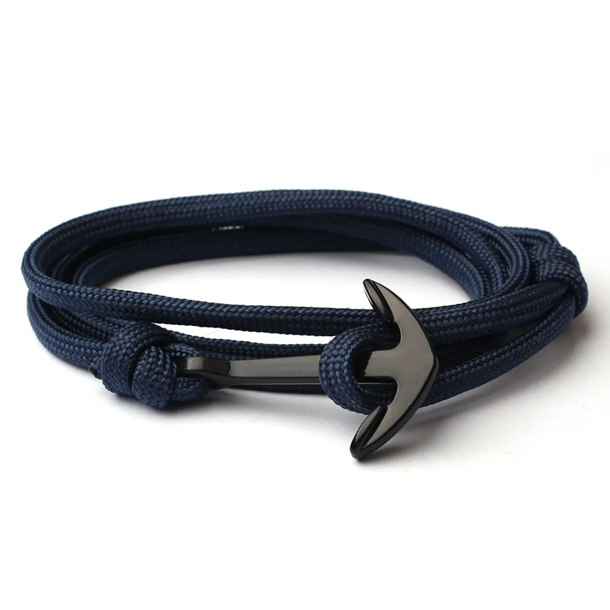 Navy blue rope bracelet with a silver anchor clasp on a white background