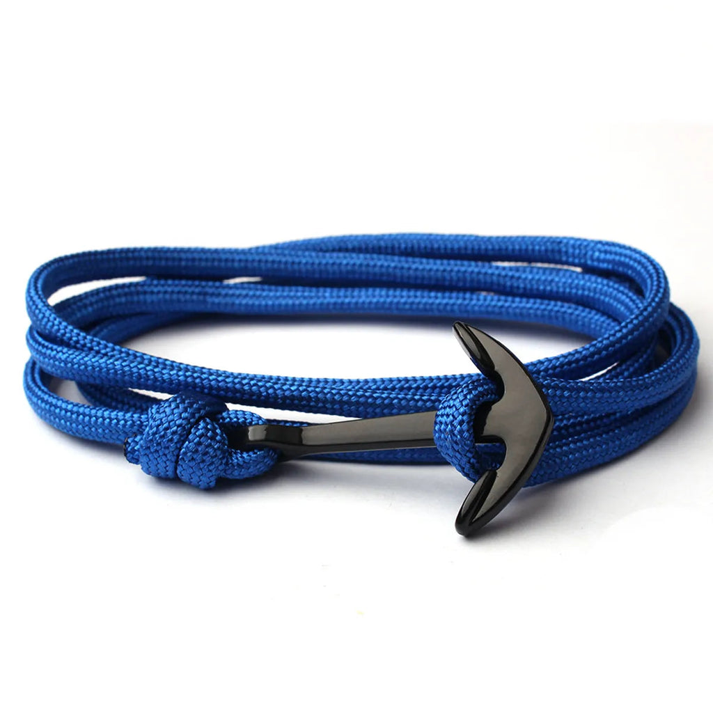 Blue braided bracelet with a black anchor charm on a white background